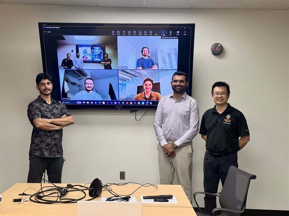 MAML members celebrating Junaid Dar's Ph.D. defense